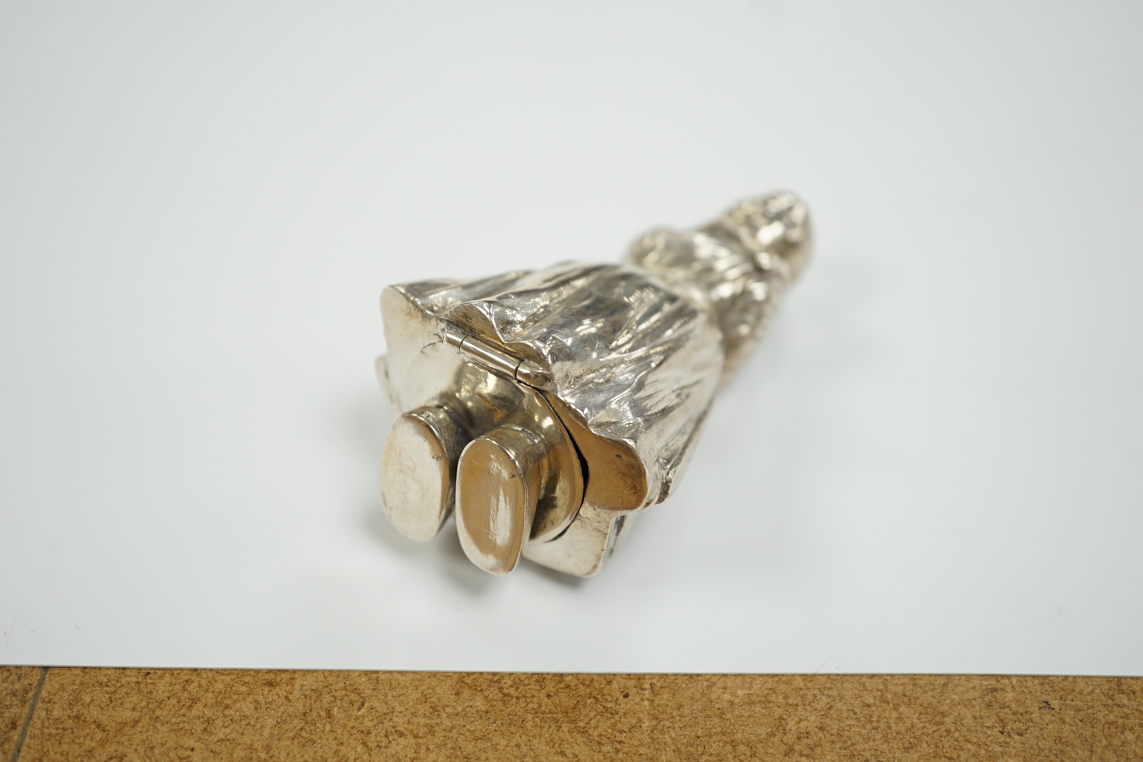 A George V silver novelty pepperette, modelled as a Dutch girl, import marks for Berthold Muller, London, 1911, 90mm.